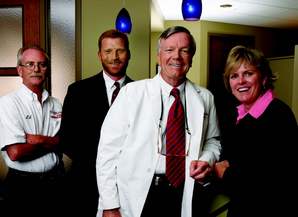 Left to right: Ed Lamport, Equipment Service Technician; Gordon Thomas, Equipment Sales Specialist; Dr. Carl Schulter; Hope Mitchell, Field Sales Consultant.