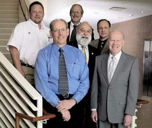 Back Row, left to right: Al Pytlik, Equipment Service Technician; Chuck Jenkins, Director, Special Markets, Equipment; Randy Kofron, Equipment Sales Specialist; Tom Kimbel, Regional General Manager; Dr. Jack Dillenberg, Dean AT Still University; Dr. Jim McGovern President, A.T. Still University