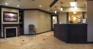 Designed to help patients feel at ease by providing an environment that feels like home. With warm colors, inset sealing, fire place, and a rug all help to bring home to the office. Being comfortable and relaxed helps settle the nerves especially to those who are particularly anxious before surgery.