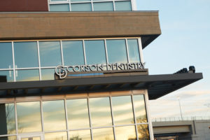 The sleek building which houses Corson Dentistry on its main level, is located in a densely populated Denver area and the exterior signage is seen by hundreds of thousands of commuters each day.