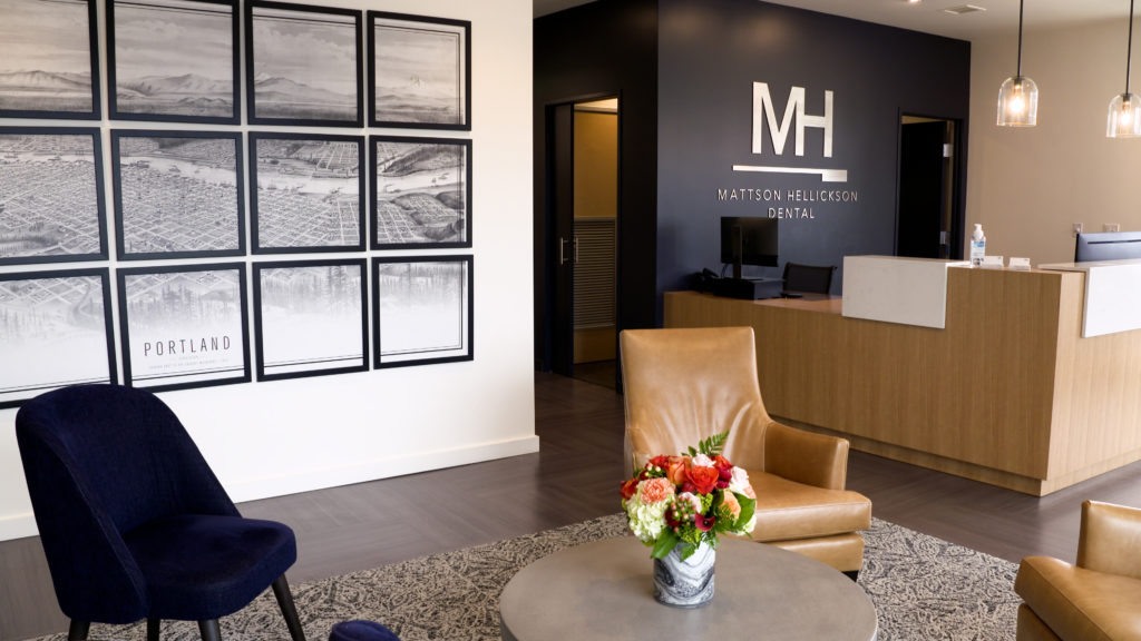 Mattson Hellickson Dental’s lobby features a gas fireplace with cushy leather chairs and an overall cozy, living room feel.