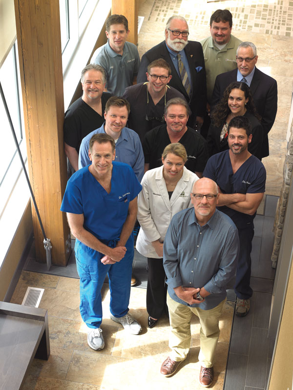 Left to right, Front row: Dr. Thomas Scherrer; Dr. Allison Emery; Dr. Derf Simes; Second row: Dr. Brian Waldau; Dr. Earl Newton; Dr. Paul Elcano; Third row: Dr. Scott Munro; Dr. Jay Oksiuta; Paty Vega, Regional Manager; Back row: Jeff Winter, Equipment Service Technician; Dan Kroeger, Equipment Sales Specialist; Bob Ross, Certified Integration Technician; Jeff Tracy, Field Sales Consultant