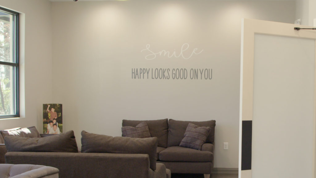 The spacious reception area—made more spacious by the extraordinary high ceiling—says “welcome” the moment patients walk in through the double-glass doors